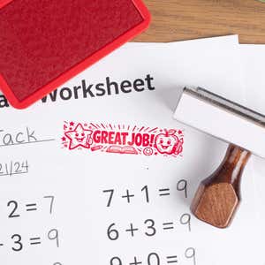 Custom wood handle teacher stamp making great job impression on worksheet