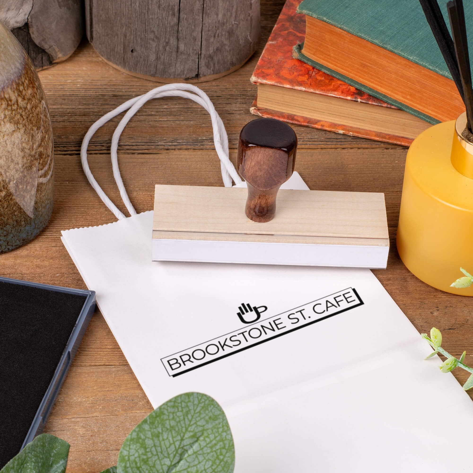 Custom 1" x 4" wood stamp branding white gift bag with cafe logo