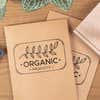 Custom logo stamp printed on kraft paper packaging using a wood mounted rubber stamp