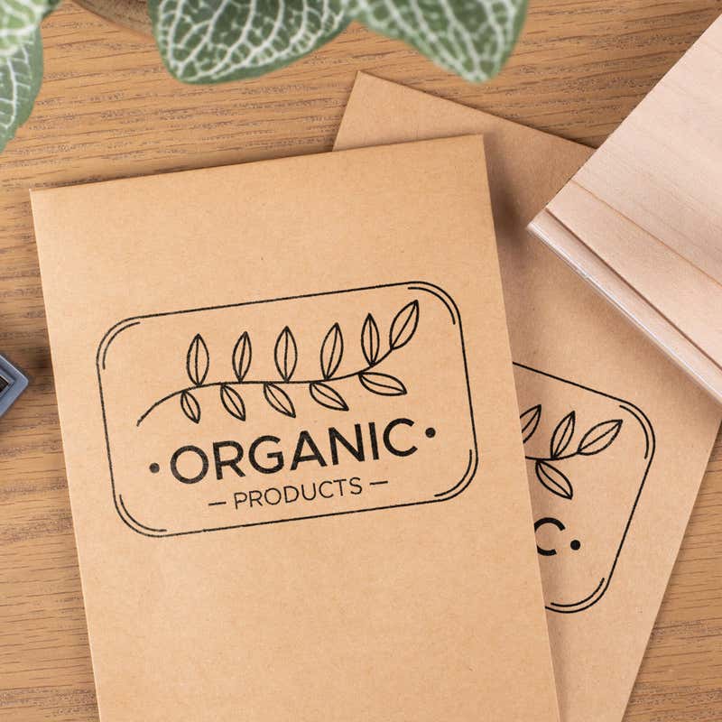 Custom logo stamp printed on kraft paper packaging using a wood mounted rubber stamp