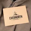 Custom branding stamp printed on a kraft hang tag for an apparel business logo.