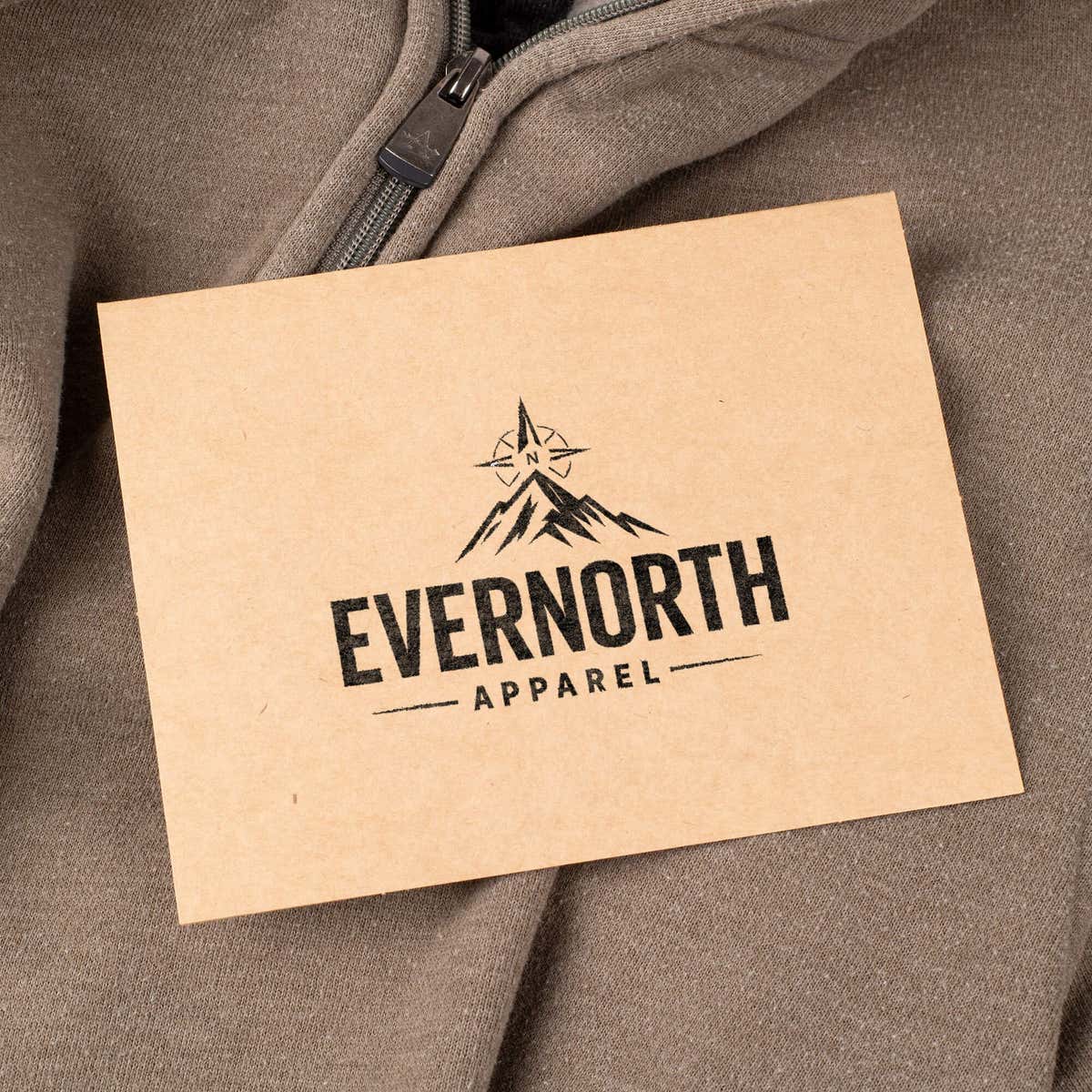 Custom branding stamp printed on a kraft hang tag for an apparel business logo.