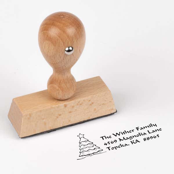 European wood hand stamp shown from above featuring custom ‘Christmas Tree Custom’ holiday return address design.