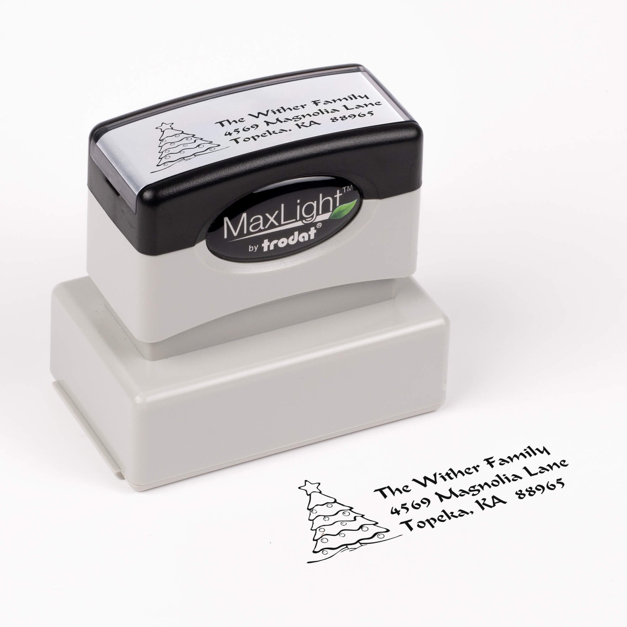 Pre-inked stamp shown from above featuring custom ‘Christmas Tree Custom’  holiday return address design.