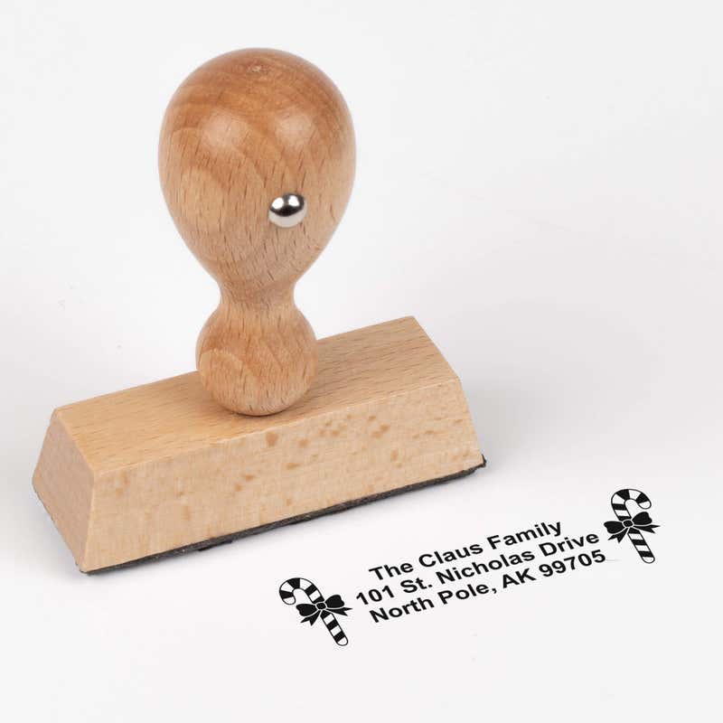 European wood hand stamp shown from above featuring custom ‘Bold Candy Canes’ holiday return address design.