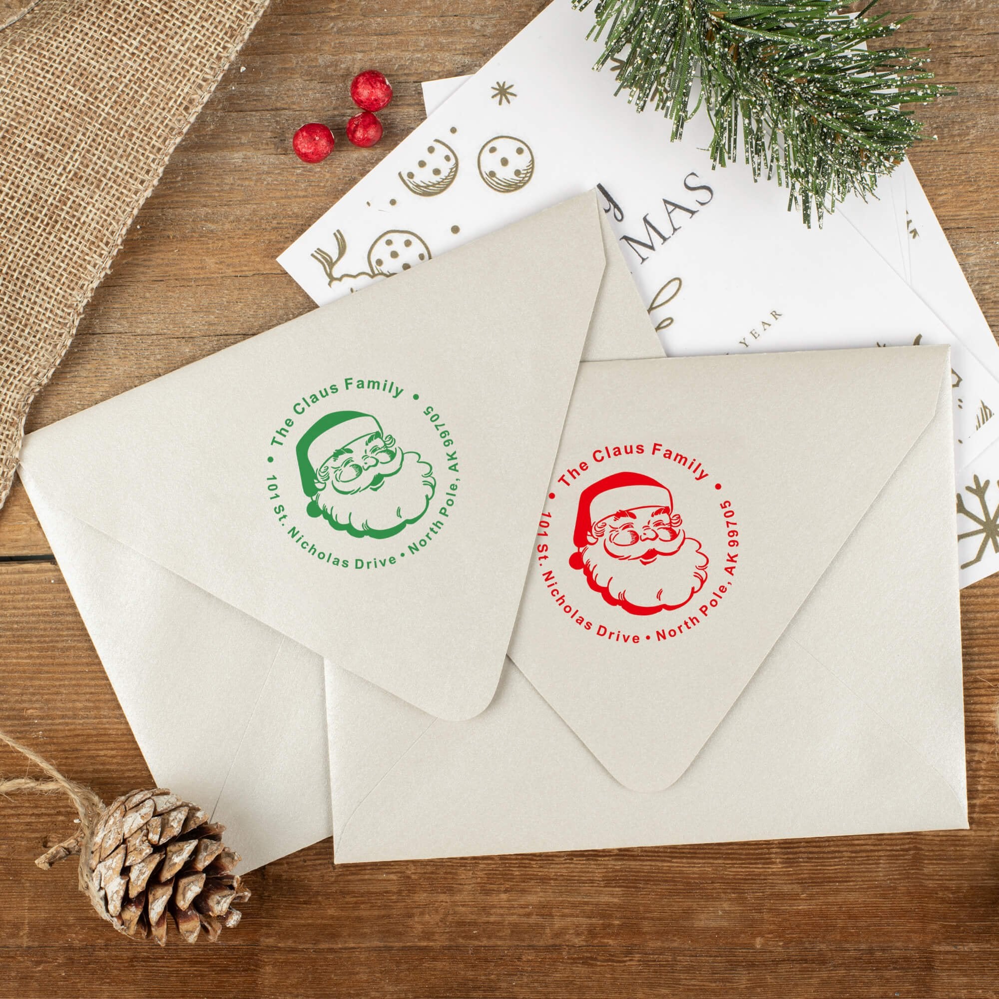 Green and red ink impressions of ‘Classic Santa’ return address stamp on Christmas envelopes.