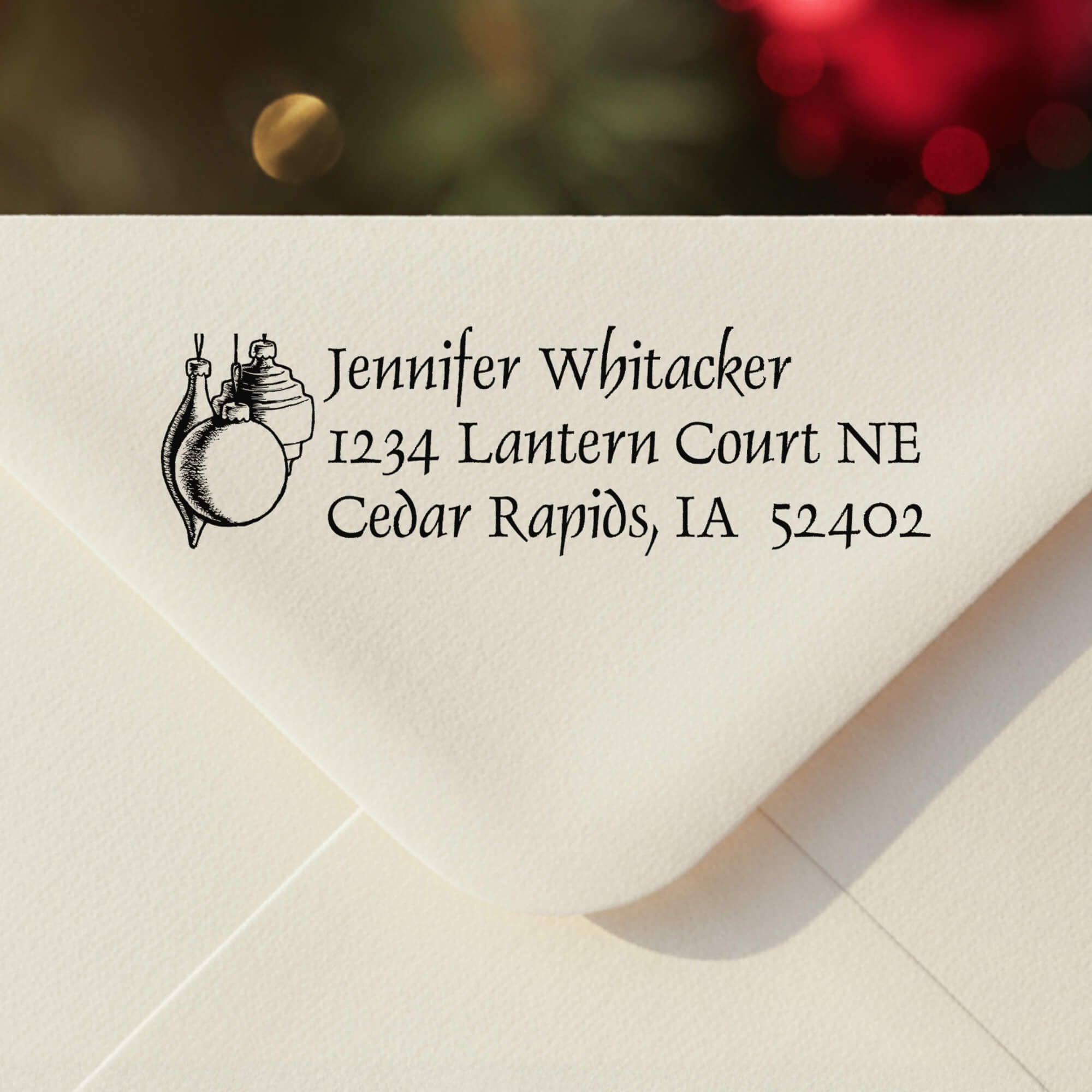 Personalized ‘Hanging Ornaments’ address stamp impression on envelope flap for holiday cards.