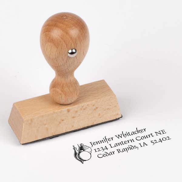 European wood hand stamp shown from above featuring custom ‘Hanging Ornaments’ holiday return address design.