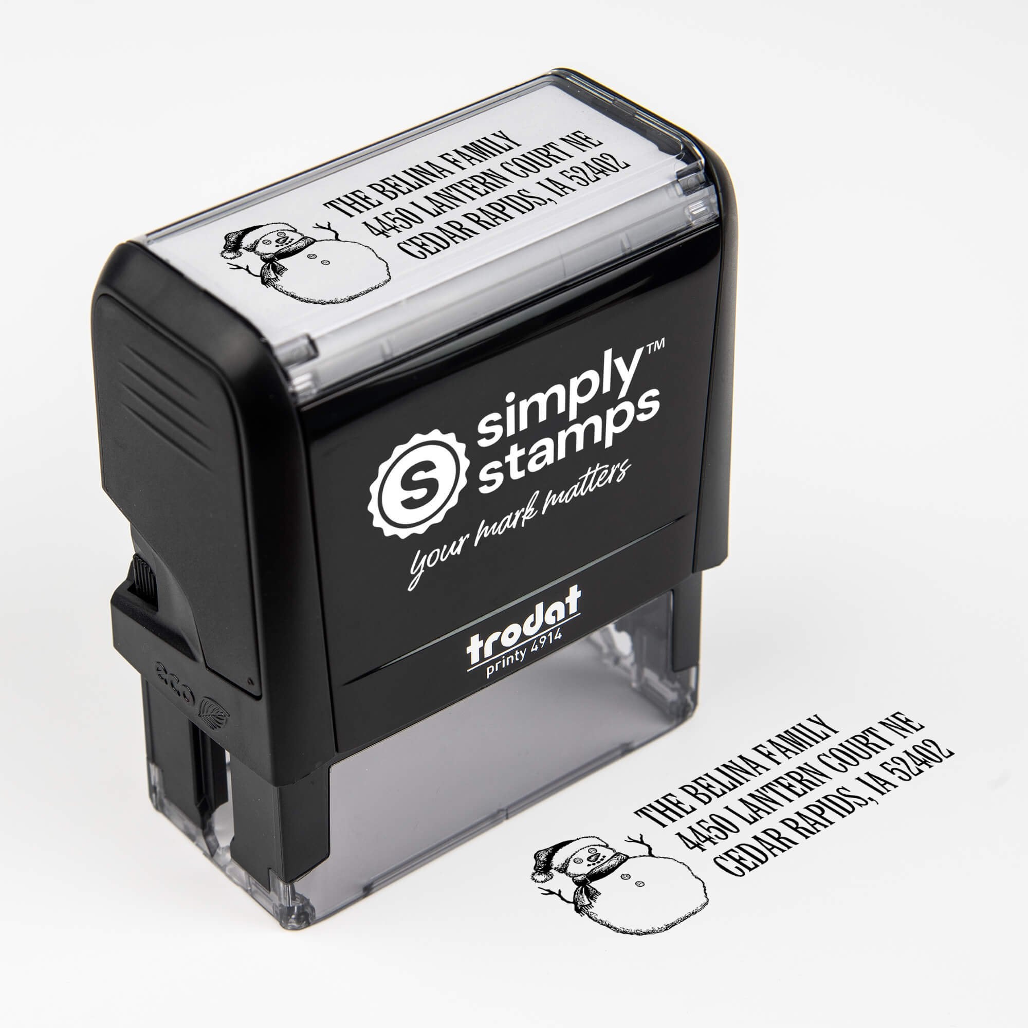 Top angle view of self-inking holiday stamp with circular ‘Sketch Snowman’ address design.