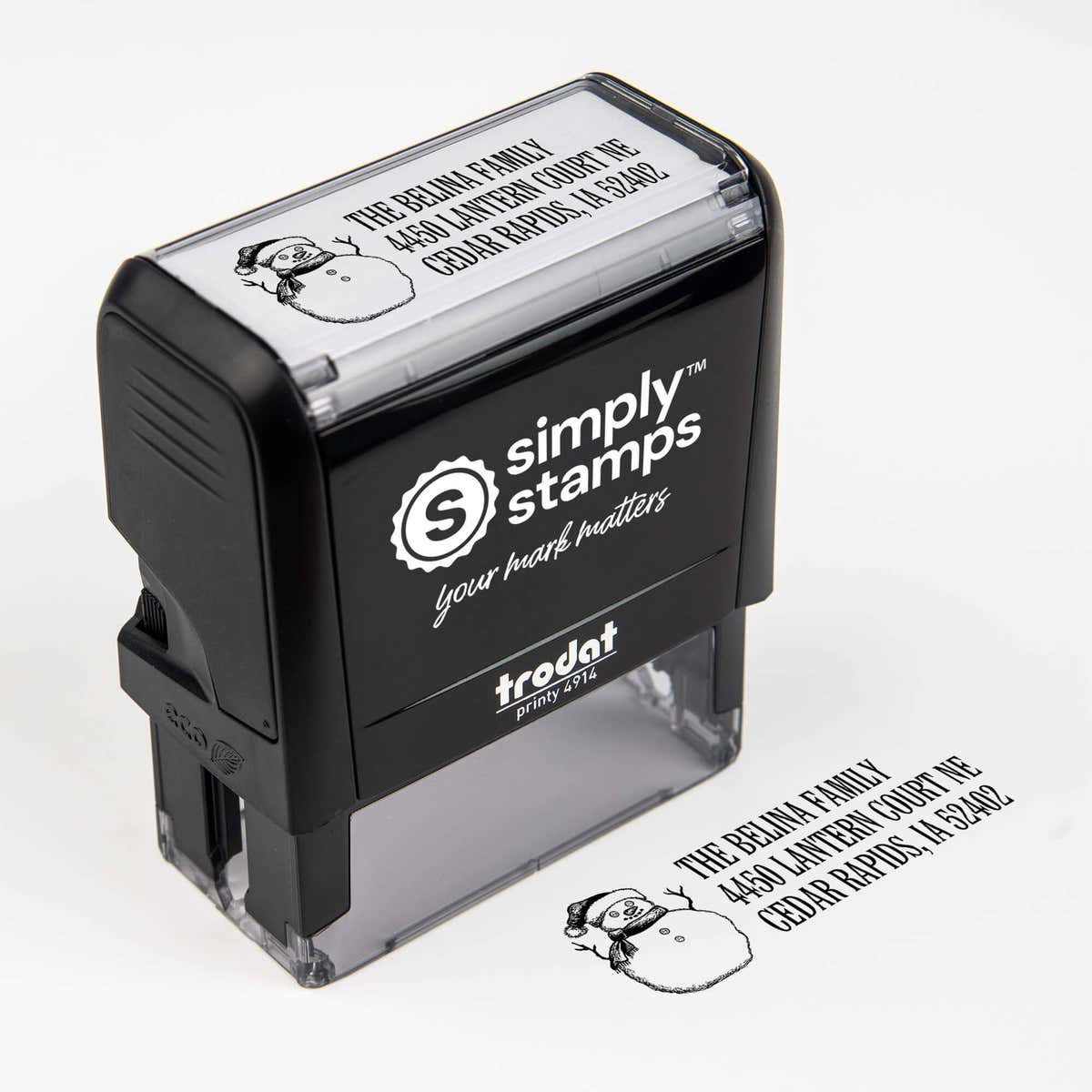 Top angle view of self-inking holiday stamp with circular ‘Sketch Snowman’ address design.
