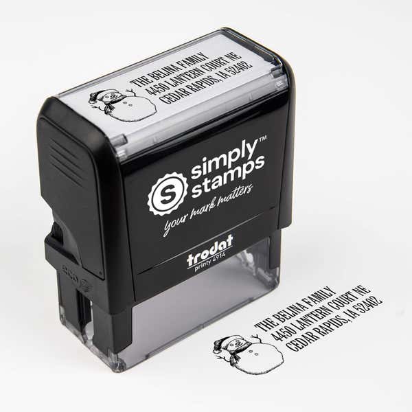 Top angle view of self-inking holiday stamp with circular ‘Sketch Snowman’ address design.