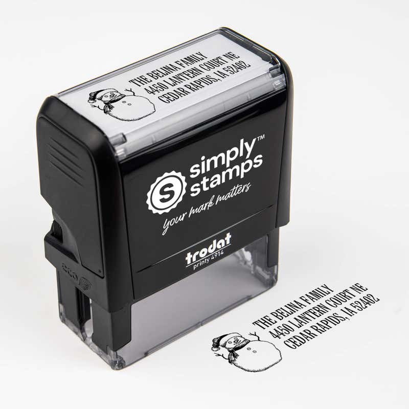 Top angle view of self-inking holiday stamp with circular ‘Sketch Snowman’ address design.