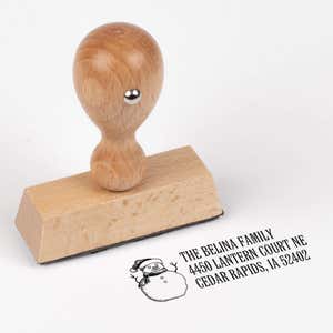 European wood hand stamp shown from above featuring custom ‘Sketch Snowman’ holiday return address design.