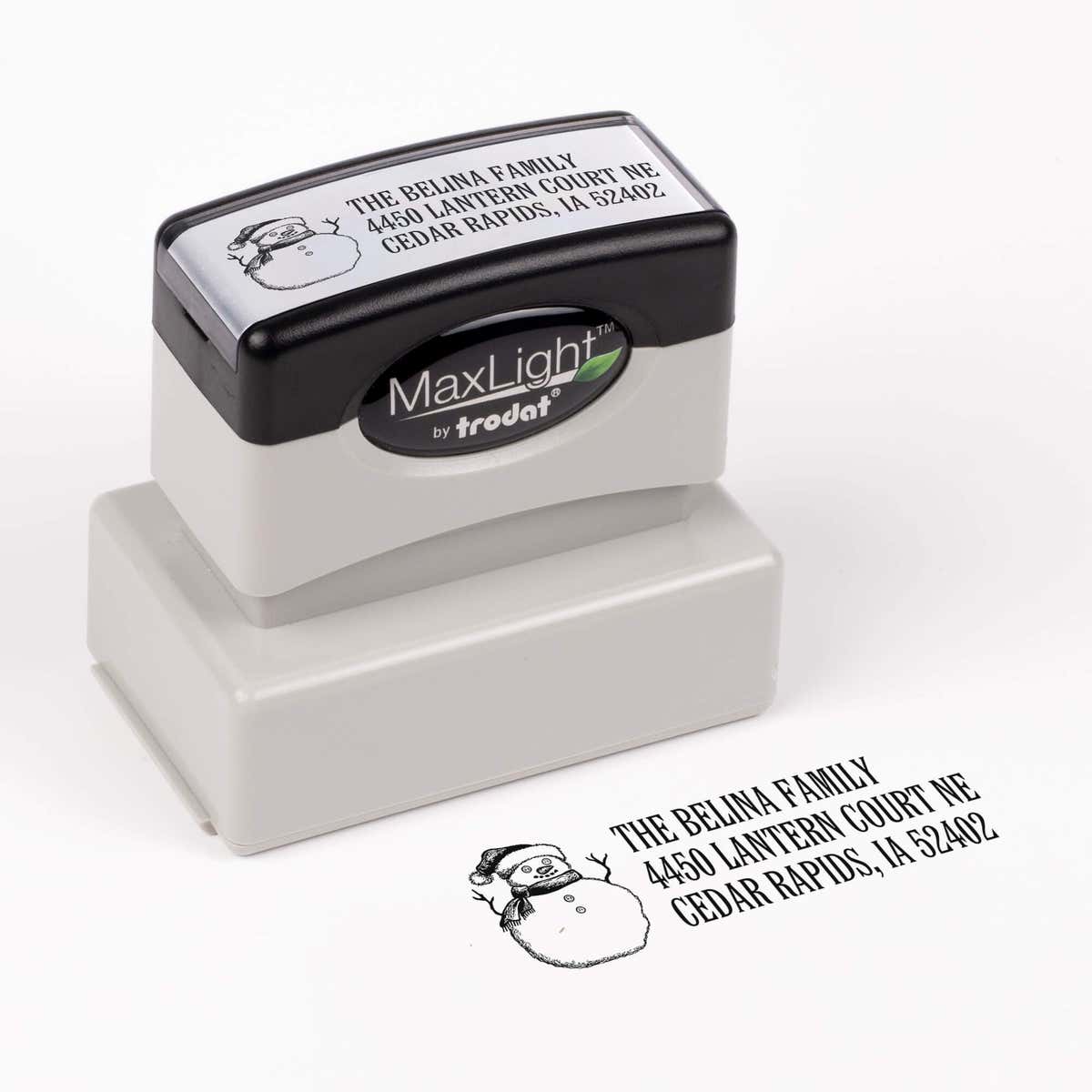 Pre-inked stamp shown from above featuring custom ‘Sketch Snowman’  holiday return address design.