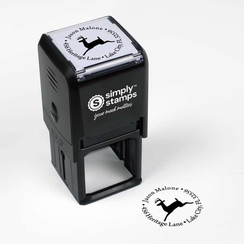 Top angle view of self-inking holiday stamp with circular ‘Leaping Reindeer Holiday’ address design.