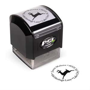 Pre-inked stamp shown from above featuring custom ‘Leaping Reindeer Holiday’  holiday return address design.