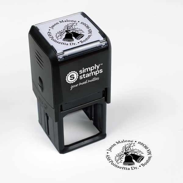 Top angle view of self-inking holiday stamp with circular ‘Holly Bells Holiday’ address design.