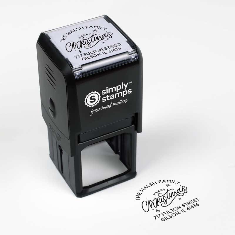 Top angle view of self-inking holiday stamp with circular ‘Merry Christmas with Snowflakes’ address design.
