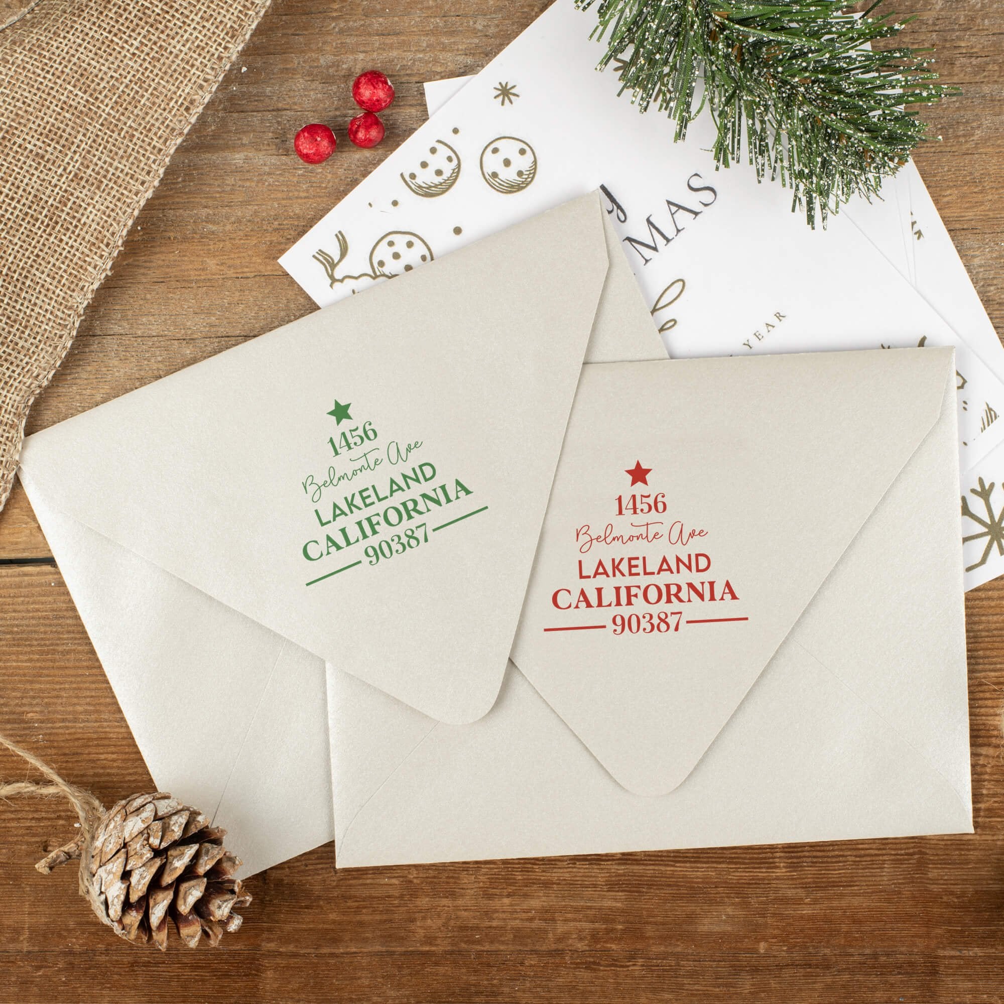Green and red ink impressions of ‘Display Christmas Tree’ return address stamp on Christmas envelopes.
