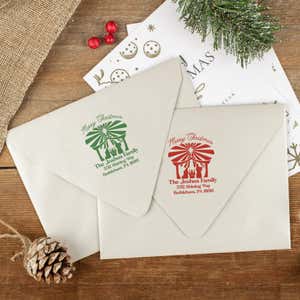 Green and red ink impressions of ‘Nativity Scene’ return address stamp on Christmas envelopes.