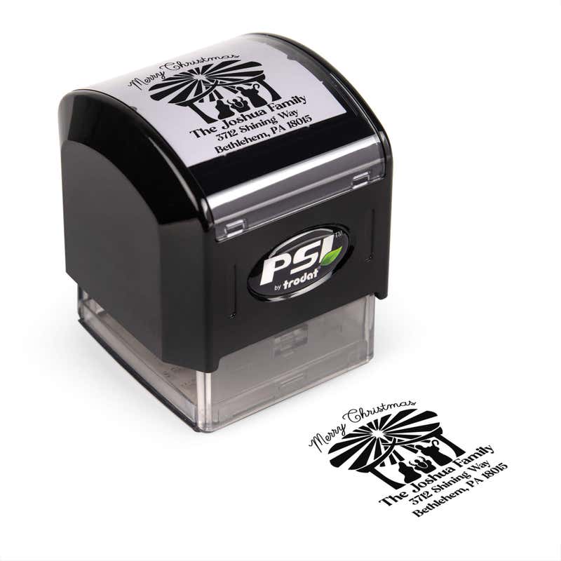 Pre-inked stamp shown from above featuring custom ‘Nativity Scene’  holiday return address design.