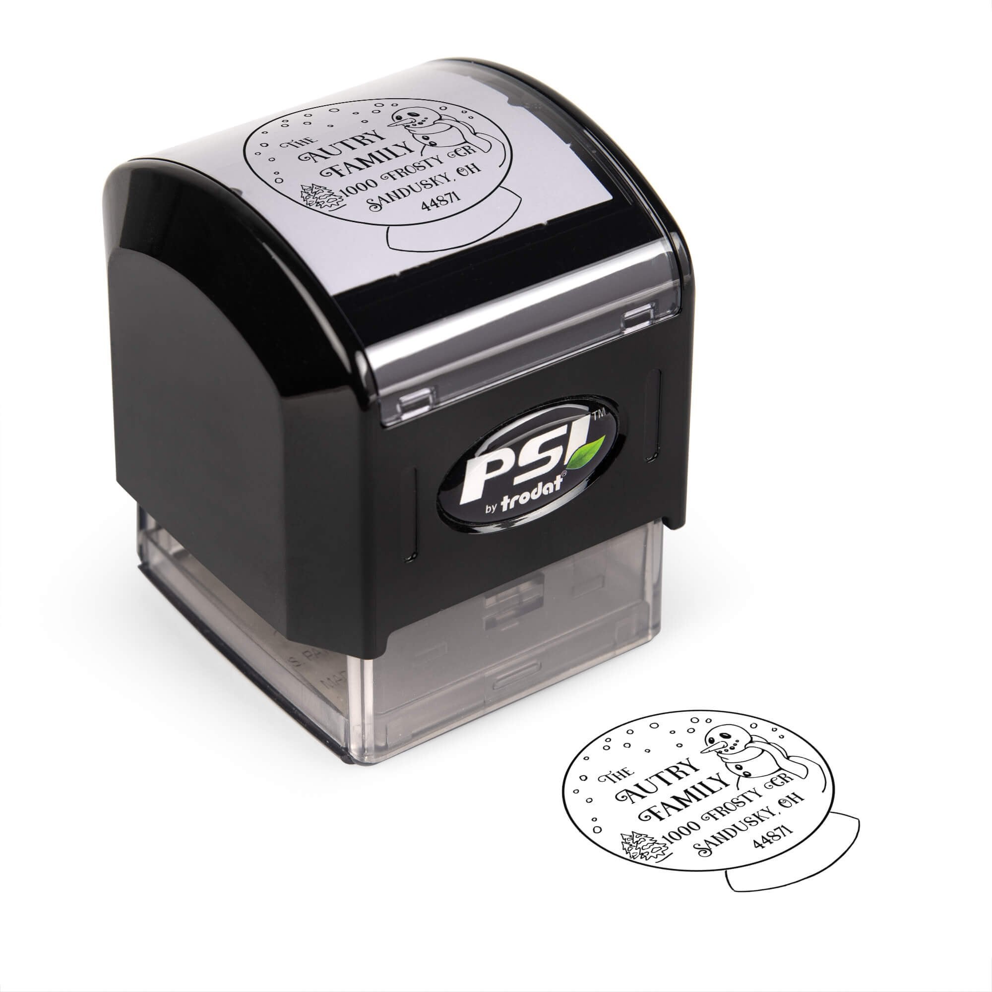 Pre-inked stamp shown from above featuring custom ‘Snow Globe’  holiday return address design.