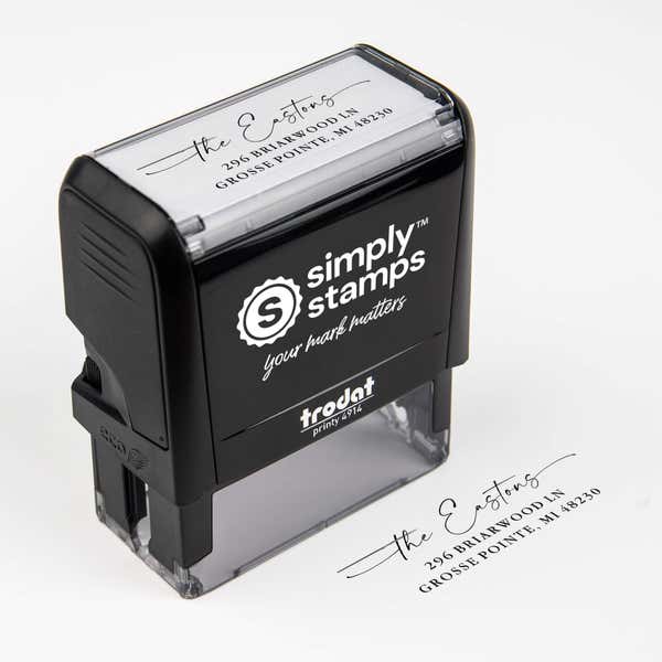 Top angle view of self-inking holiday stamp with circular ‘Signature Script Family Name’ address design.