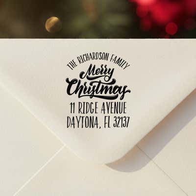 Personalized ‘Classic Merry Christmas’ address stamp impression on envelope flap for holiday cards.