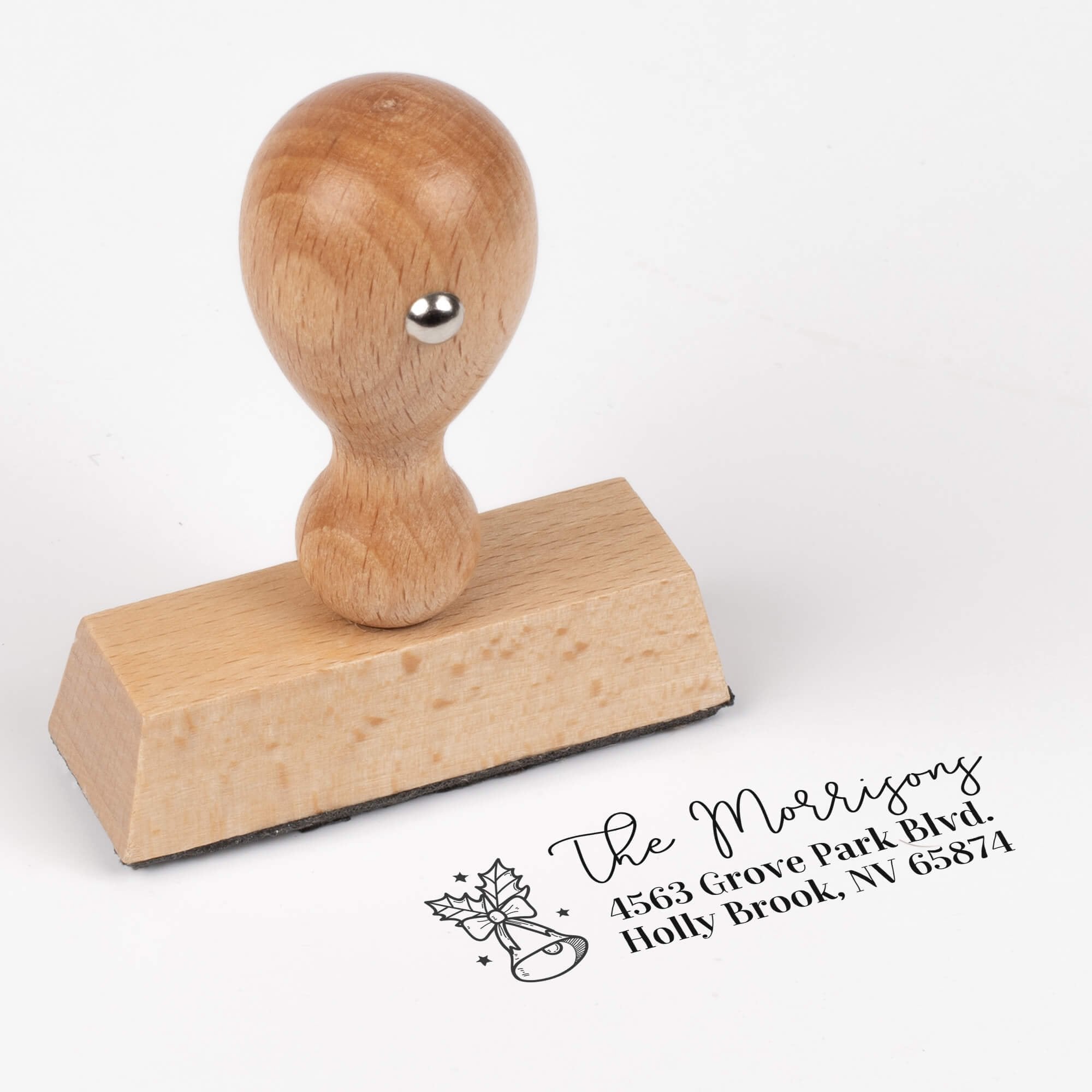 Wood Handle custom address stamp featuring festive bell and holly design with personalized address impression
