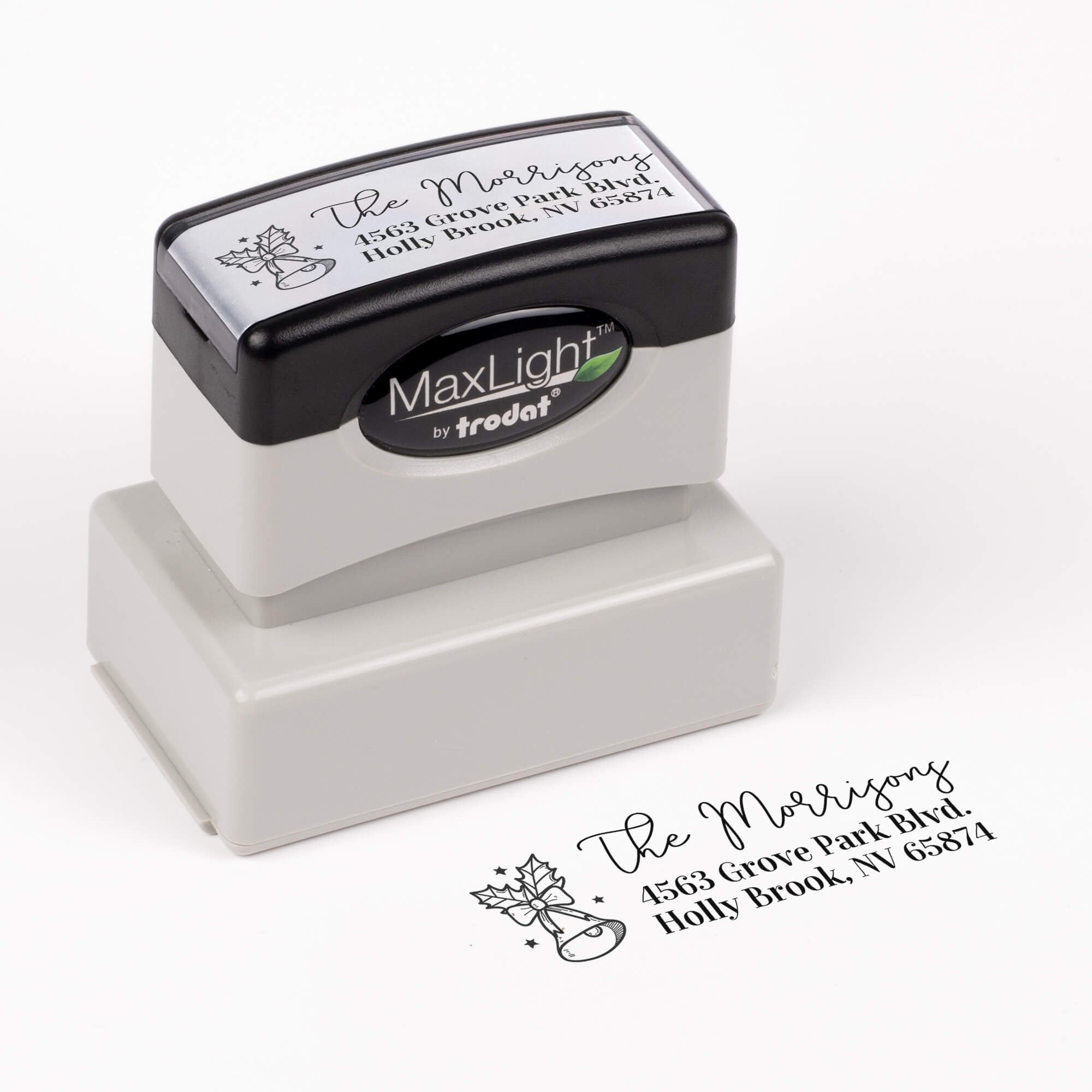 Pre-inked custom address stamp featuring festive bell and holly design with personalized address impression