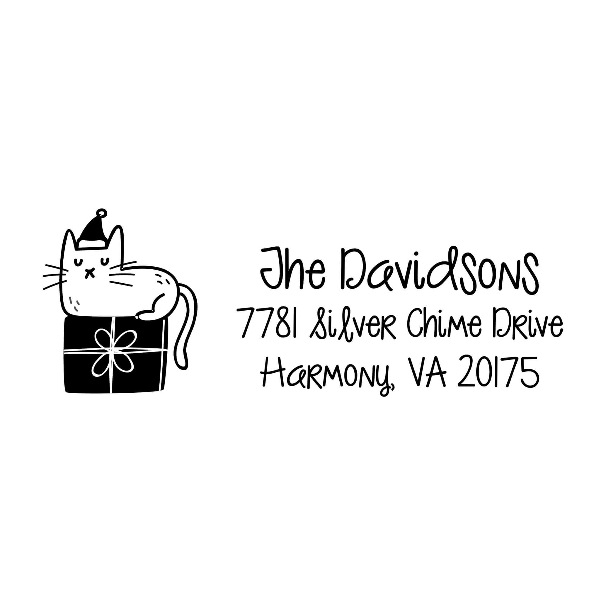 Holiday address stamp design featuring ‘Holiday Cat’ with personalized family name and address.