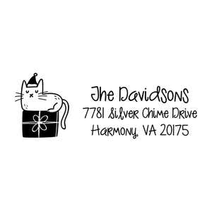 Holiday address stamp design featuring ‘Holiday Cat’ with personalized family name and address.