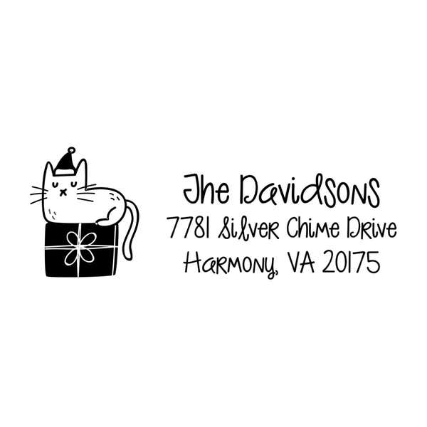 Holiday address stamp design featuring ‘Holiday Cat’ with personalized family name and address.
