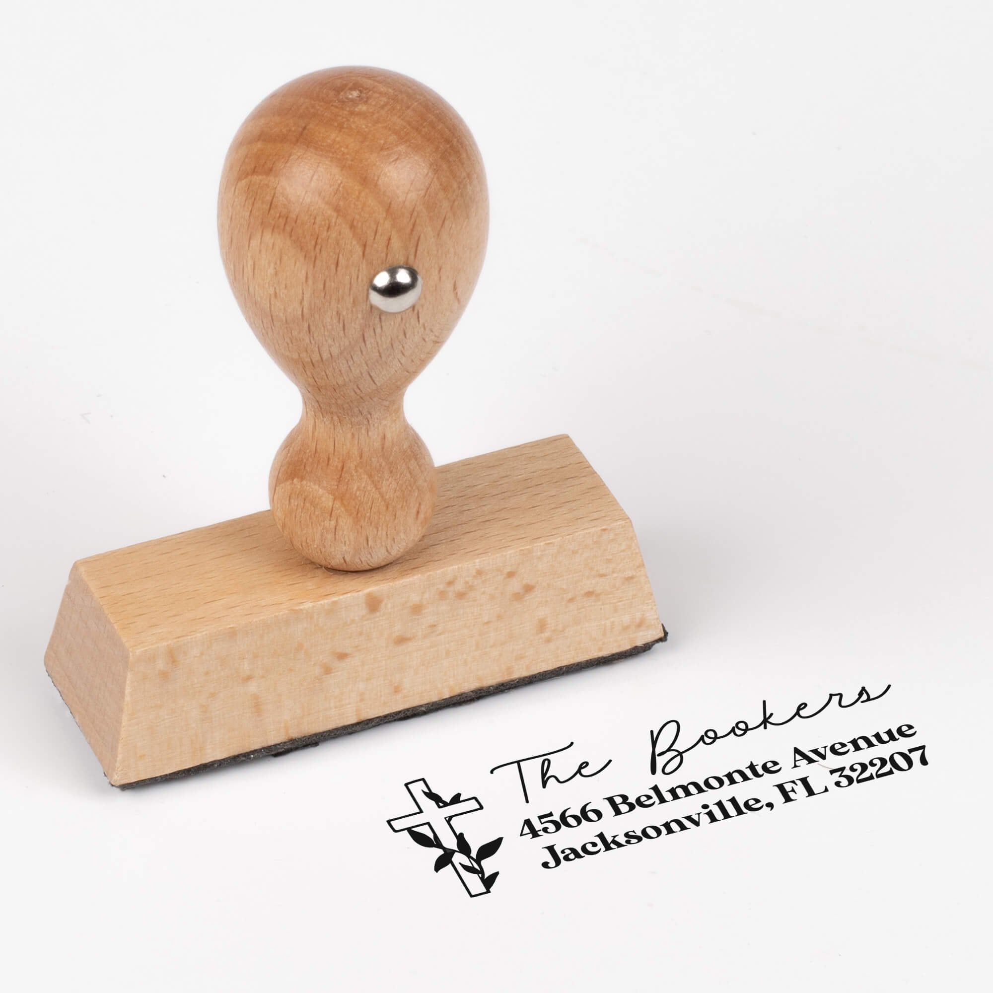 European wood hand stamp shown from above featuring custom ‘Religious Cross Christmas’ holiday return address design.