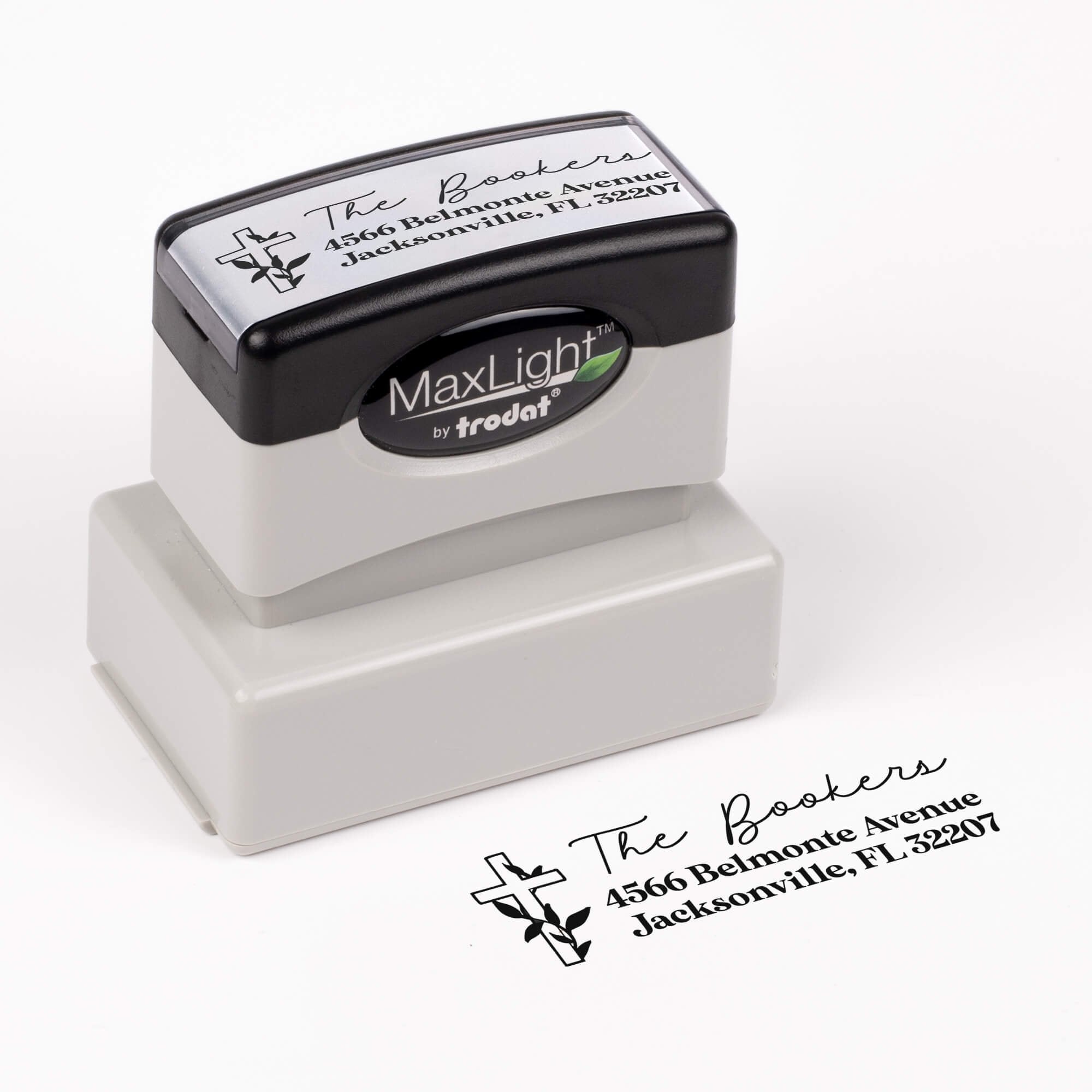 Pre-inked stamp shown from above featuring custom ‘Religious Cross Christmas’  holiday return address design.
