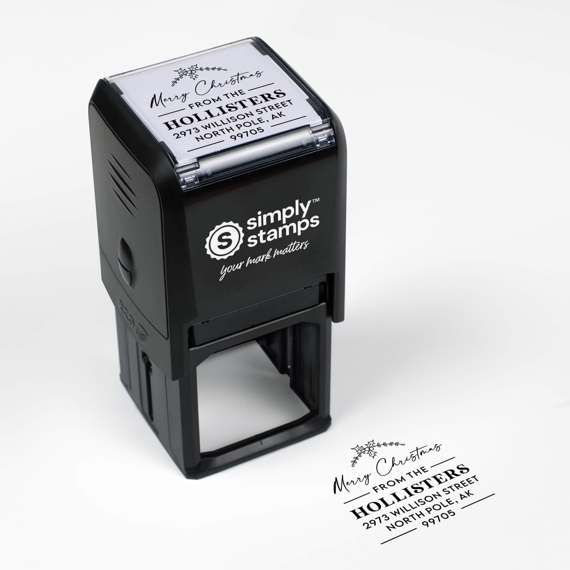 Top angle view of self-inking holiday stamp with circular ‘Merry Christmas’ address design.