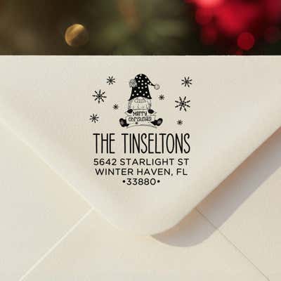Personalized ‘Christmas Gnome’ address stamp impression on envelope flap for holiday cards.