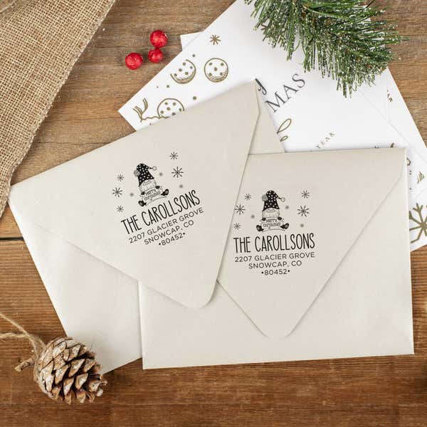 Green and red ink impressions of ‘Christmas Gnome’ return address stamp on Christmas envelopes.