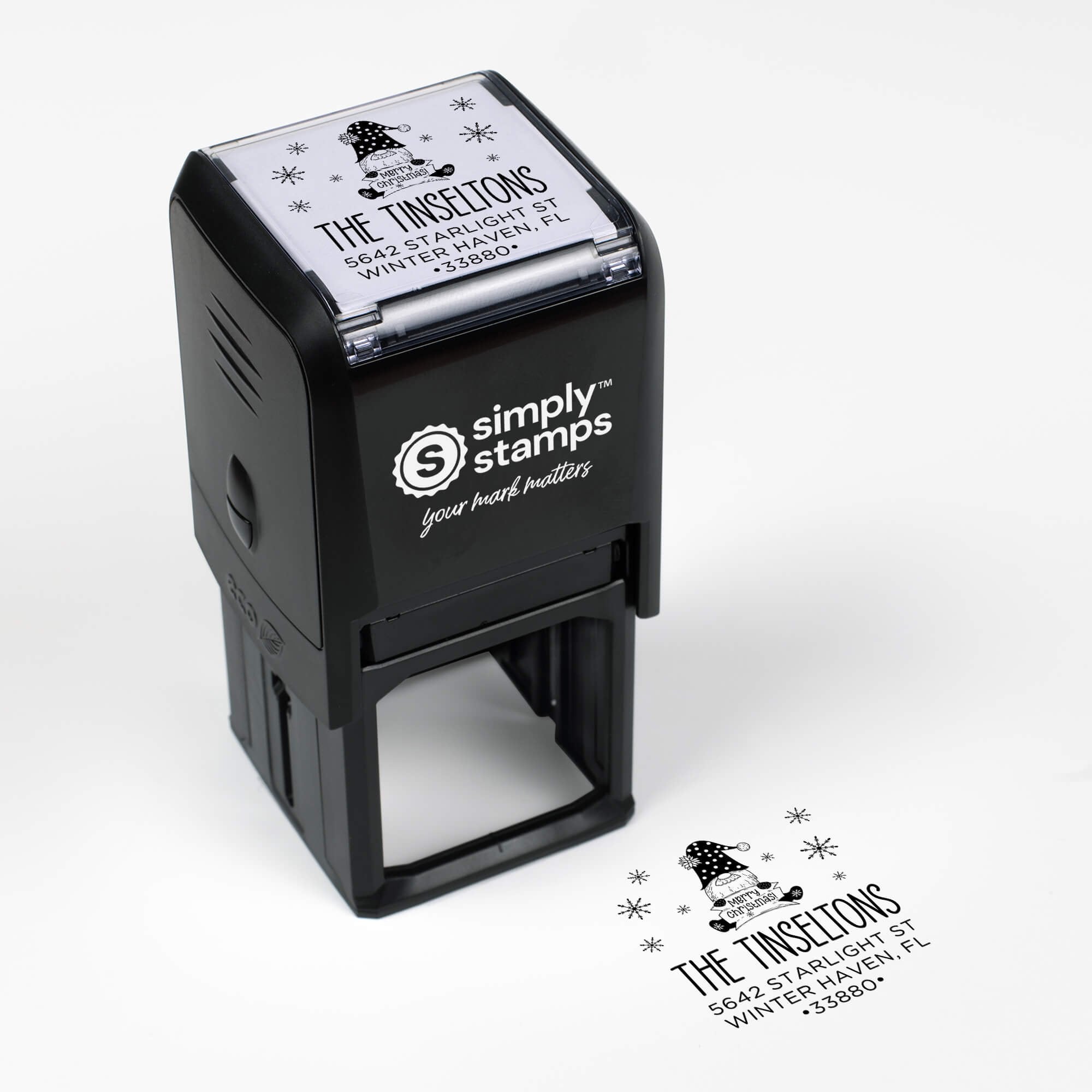 Top angle view of self-inking holiday stamp with circular ‘Christmas Gnome’ address design.