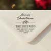 Personalized ‘Magnolia Merry Christmas’ address stamp impression on envelope flap for holiday cards.