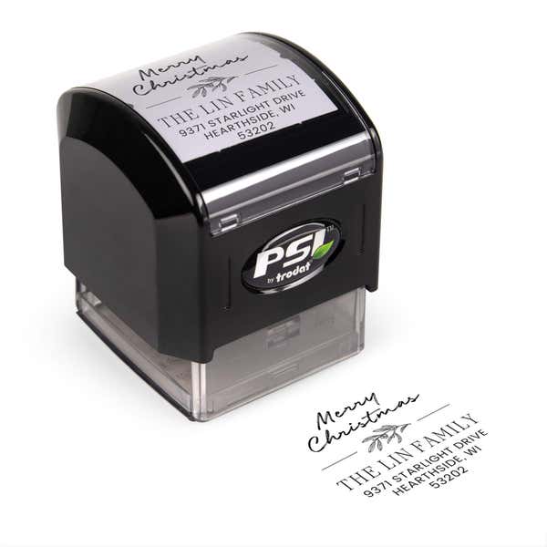 Pre-inked stamp shown from above featuring custom ‘Magnolia Merry Christmas’  holiday return address design.