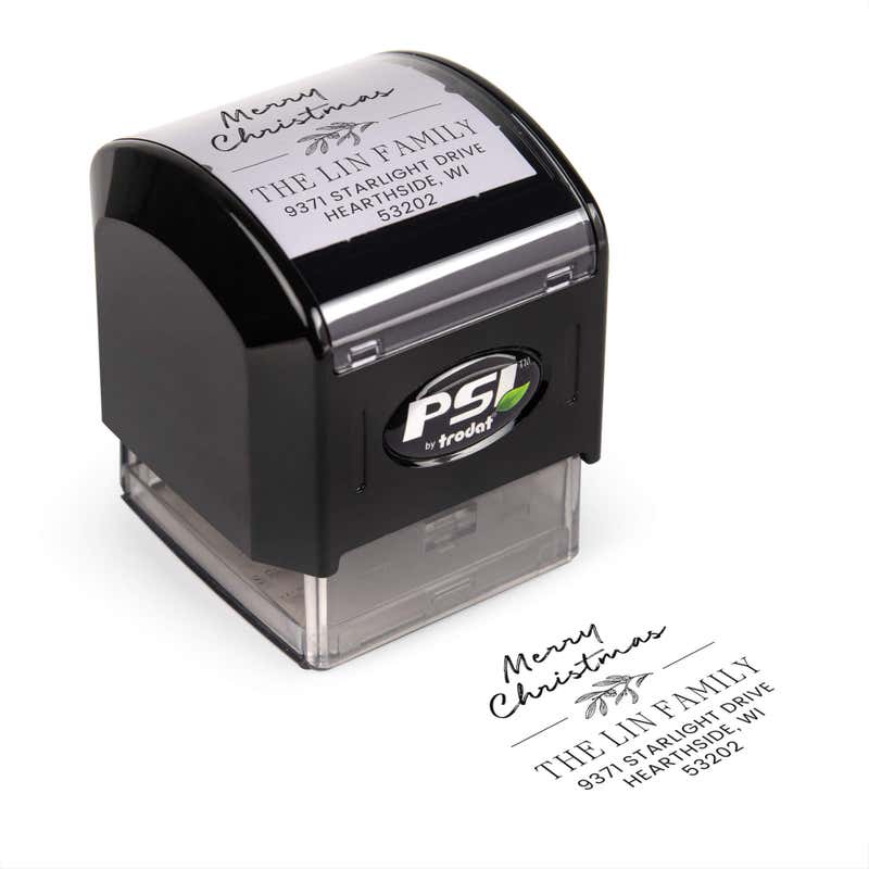 Pre-inked stamp shown from above featuring custom ‘Magnolia Merry Christmas’  holiday return address design.