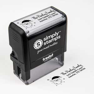 Top angle view of self-inking holiday stamp with circular ‘Santa Claus’ address design.