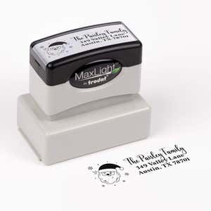 Pre-inked stamp shown from above featuring custom ‘Santa Claus’  holiday return address design.