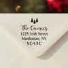Personalized ‘Tiny Trees Christmas’ address stamp impression on envelope flap for holiday cards.
