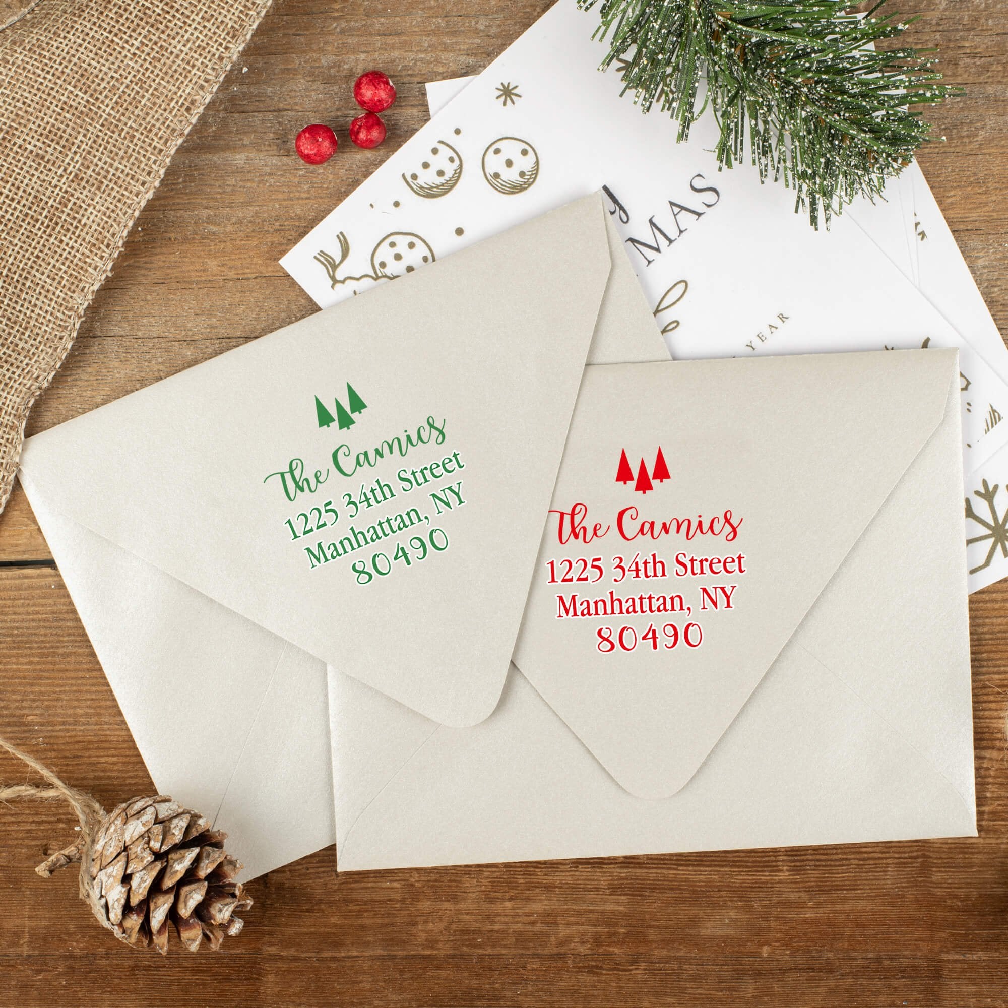 Green and red ink impressions of ‘Tiny Trees Christmas’ return address stamp on Christmas envelopes.