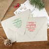 Green and red ink impressions of ‘Merry Everything’ return address stamp on Christmas envelopes.