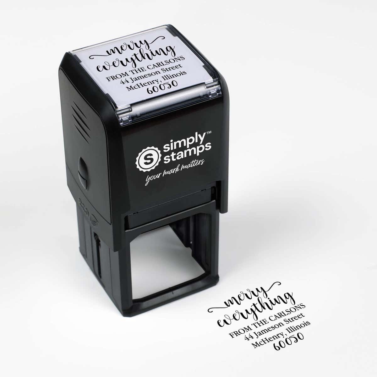 Top angle view of self-inking holiday stamp with circular ‘Merry Everything’ address design.