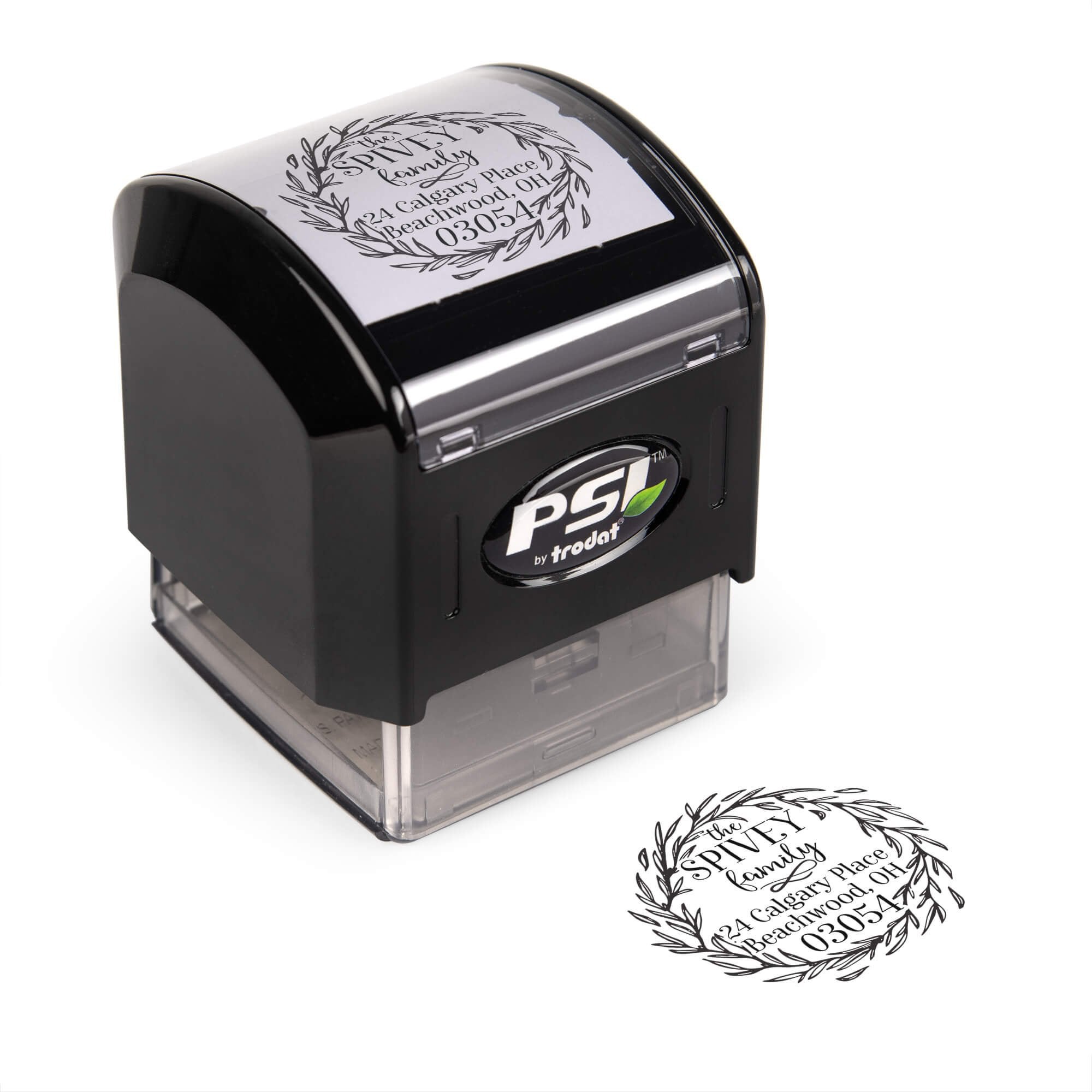 Pre-inked stamp shown from above featuring custom ‘Christmas Wreath Outline holiday return address design.