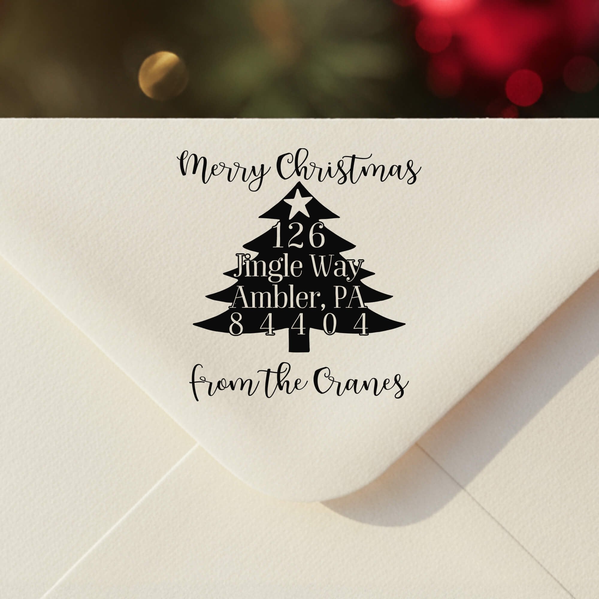 Personalized ‘Christmas Tree’ address stamp impression on envelope flap for holiday cards.